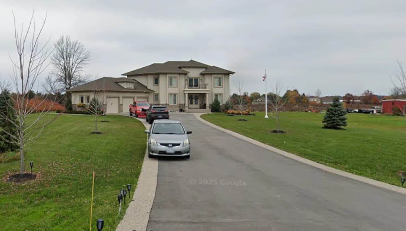 Street photograph of 2367 Fourth Avenue showing the house, garage wing, long driveway and front lawn