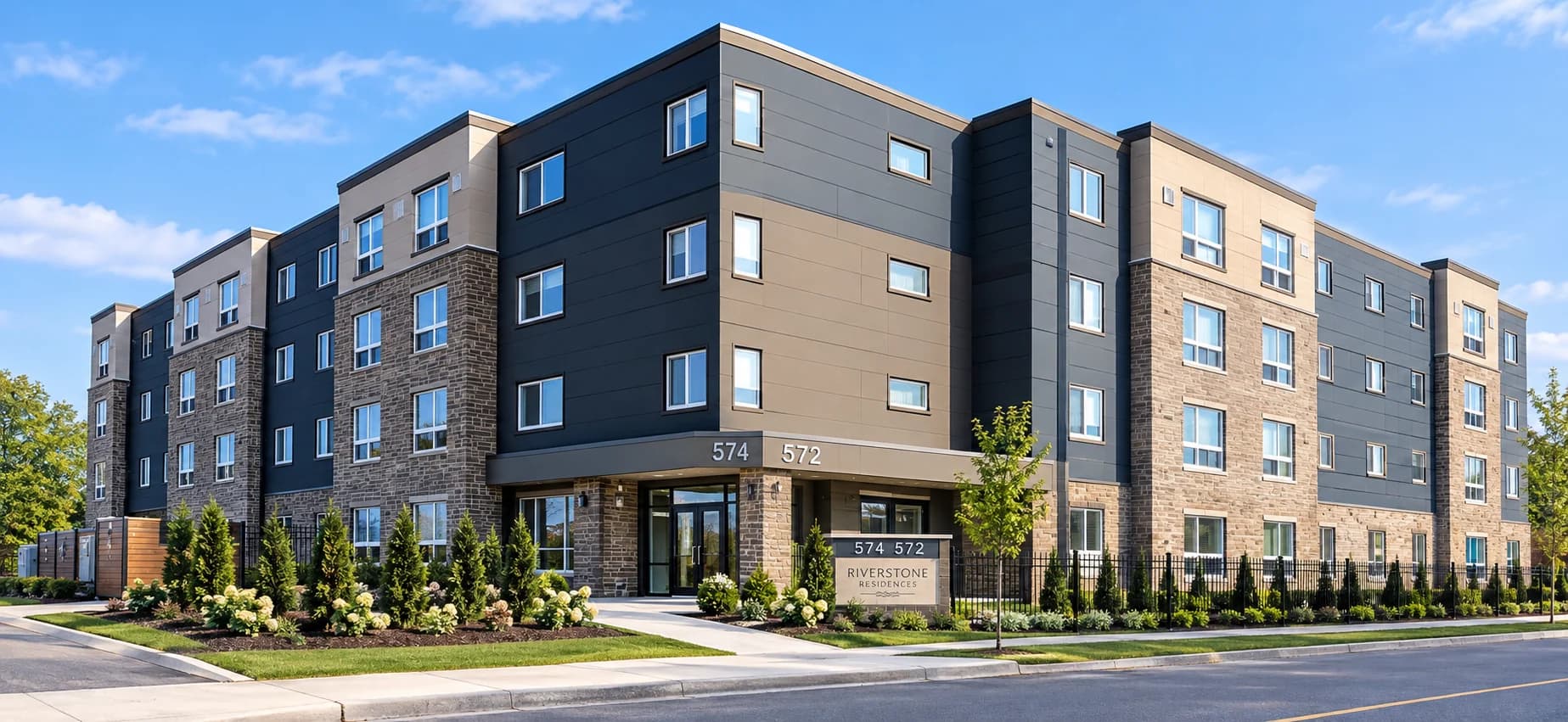 Exterior visualization of the apartment building at 574 King Street with stone walls, dark facade panels and a glazed corner entrance